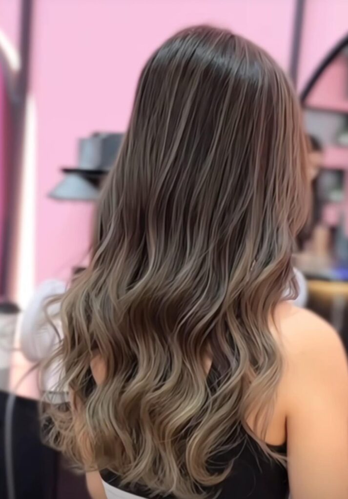 Ash brown airtouch balayage hair colour with layered waves at Singapore salon