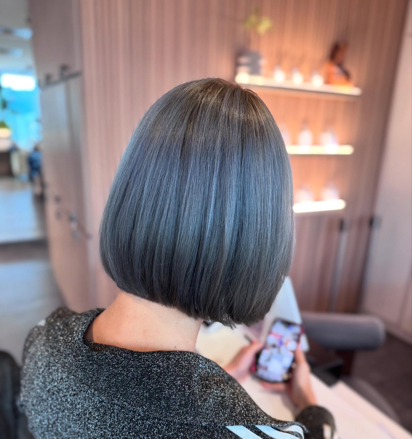 Women’s hair salon Tampines showing smooth short bob haircut with clean professional finish